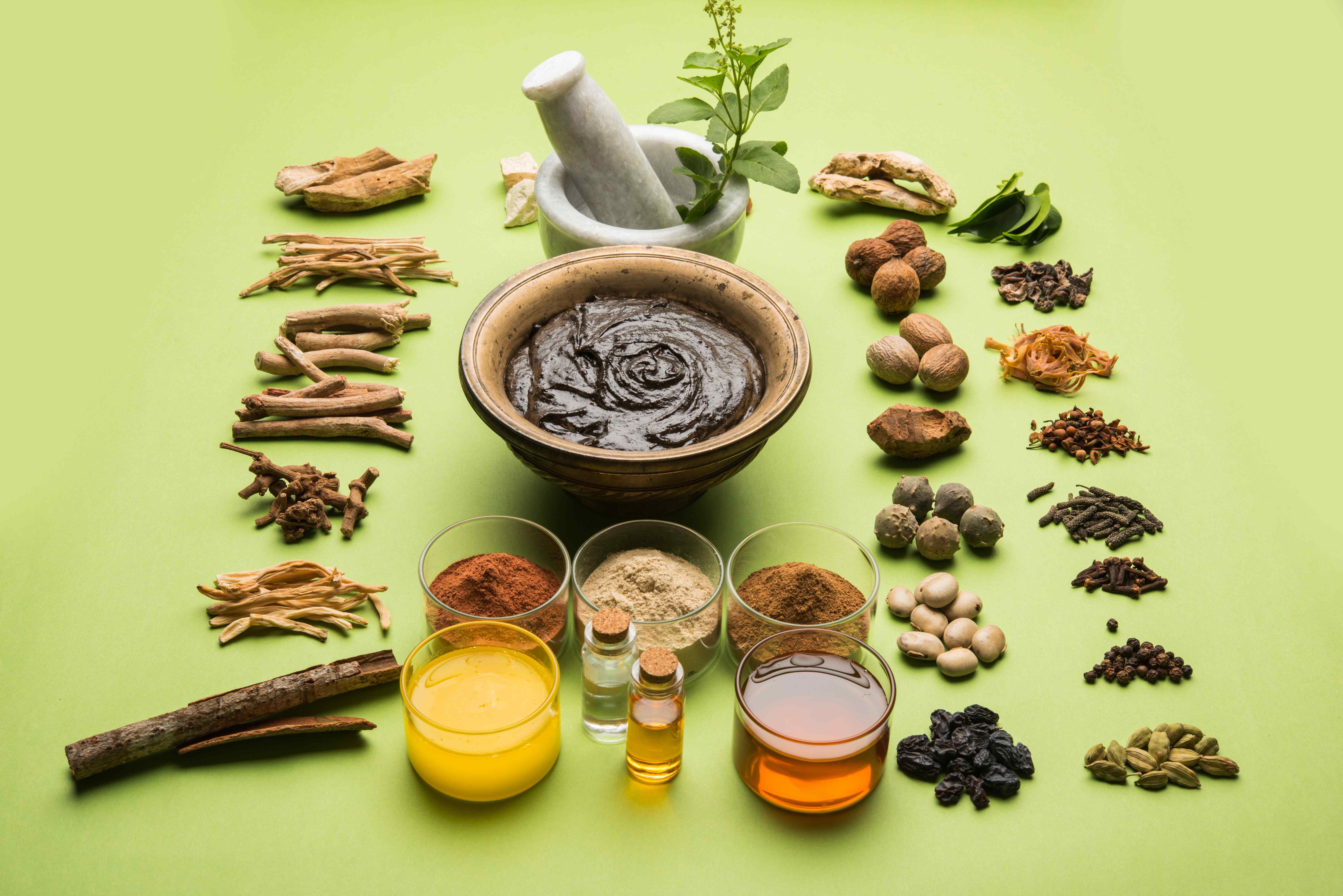 Ayurvedic herbs, spices, and preparations with mortar and pestle